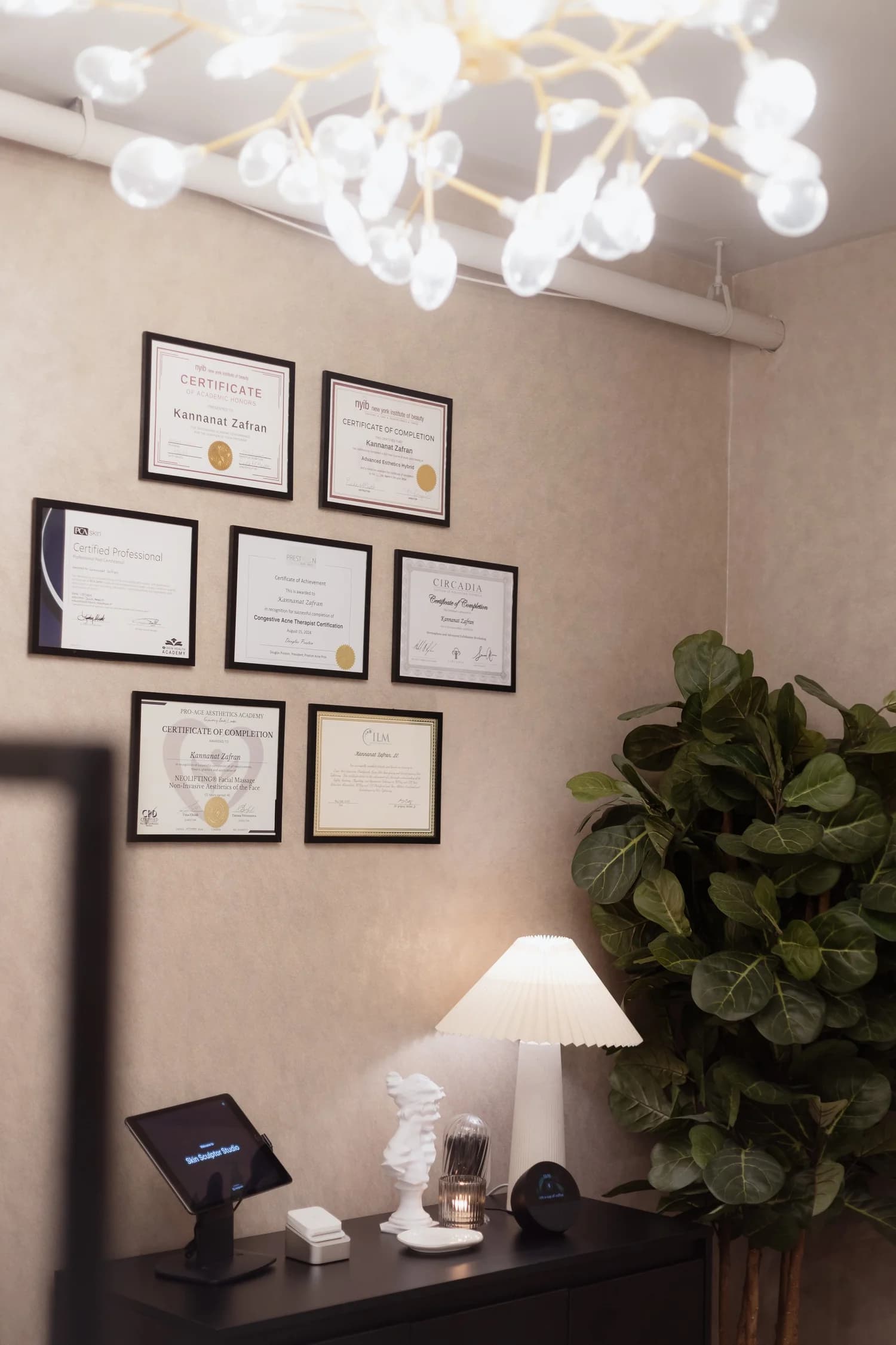 Framed certifications on the wall of the Skin Sculptor Studio reception in Manhattan.